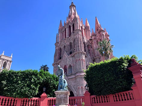 Jardín Principal, where locals gather and mariachis serenade and Parroquia de San Miguel Arcángel—its pink facade glowing in the evening light.