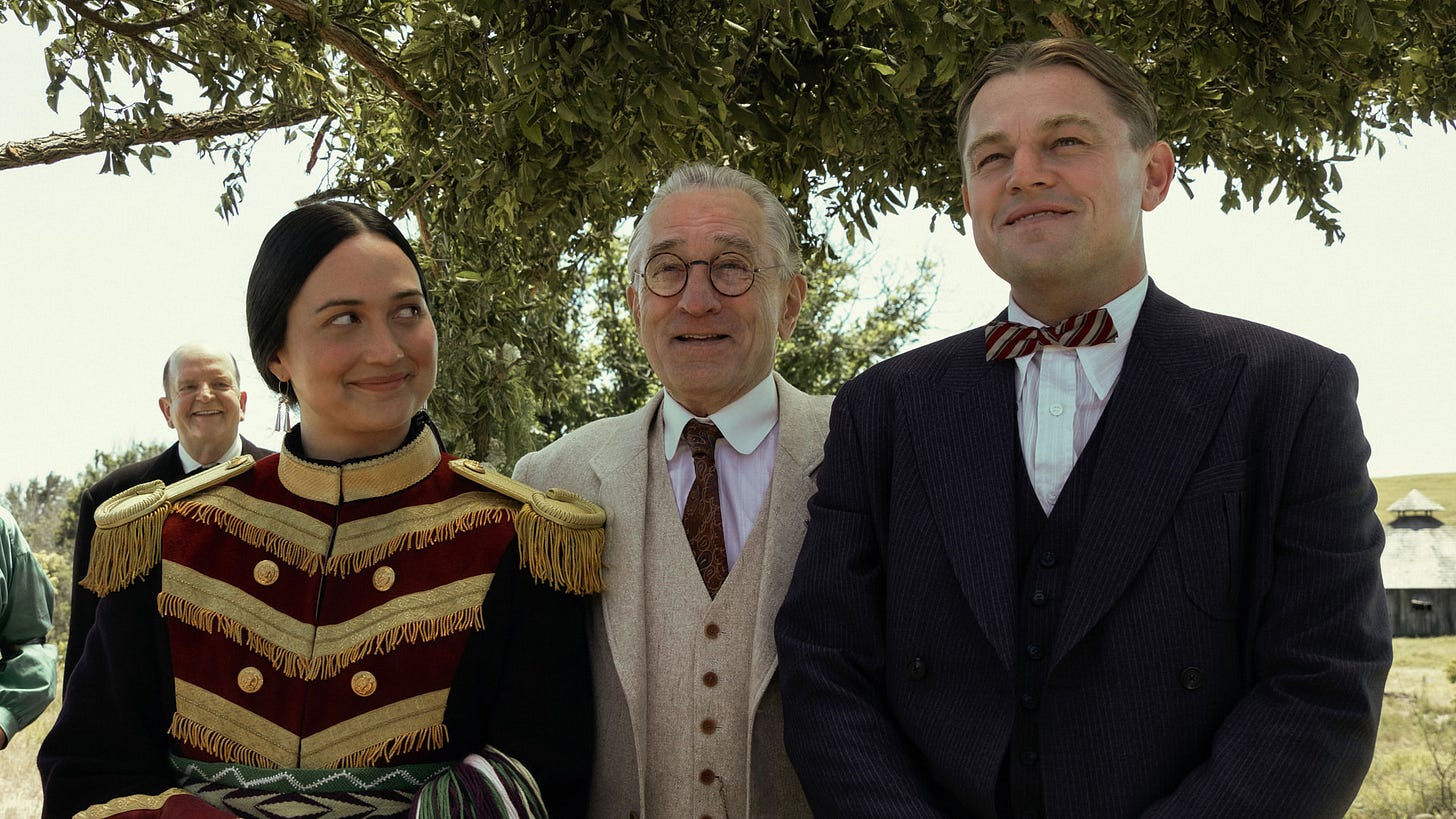 Lily Gladstone, Robert De Niro and Leonardo DiCaprio in “Killers of the Flower Moon,” in theaters now.