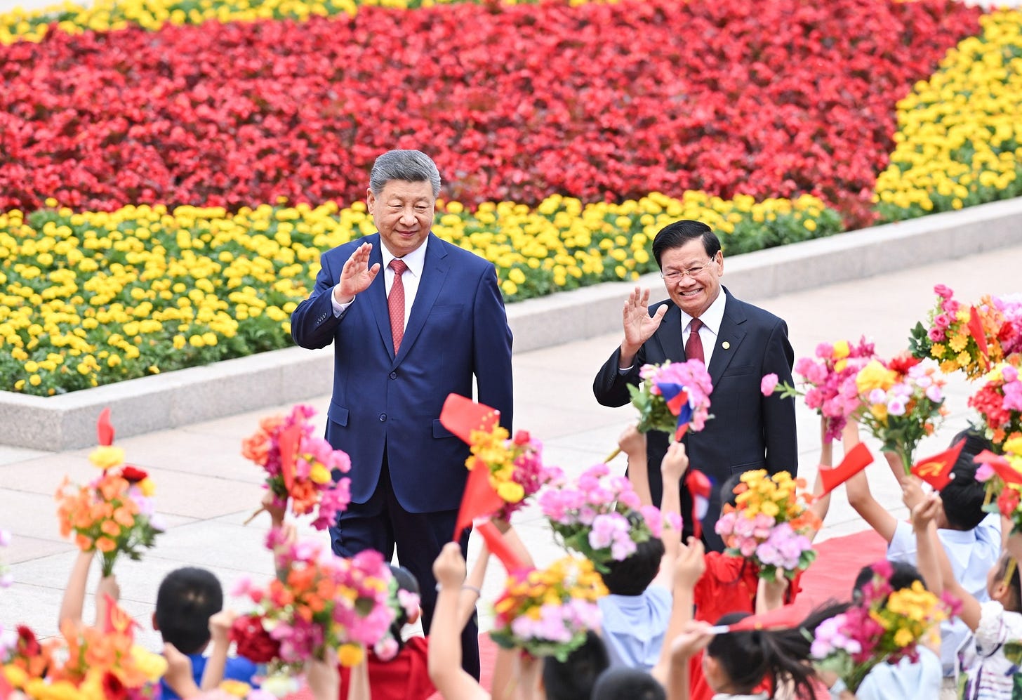 Xi Jinping and Lao President Thongloun Sisoulith during the June 2026 visit advancing the “all-weather community with a shared future.”