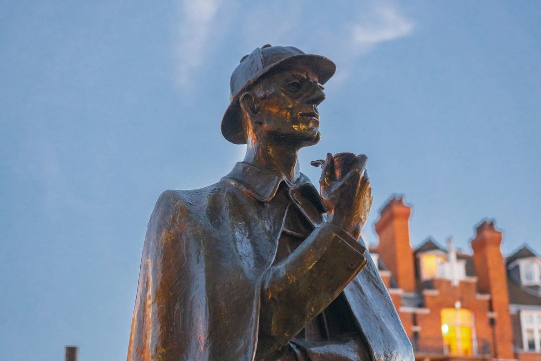 A statue of a man holding a pipe