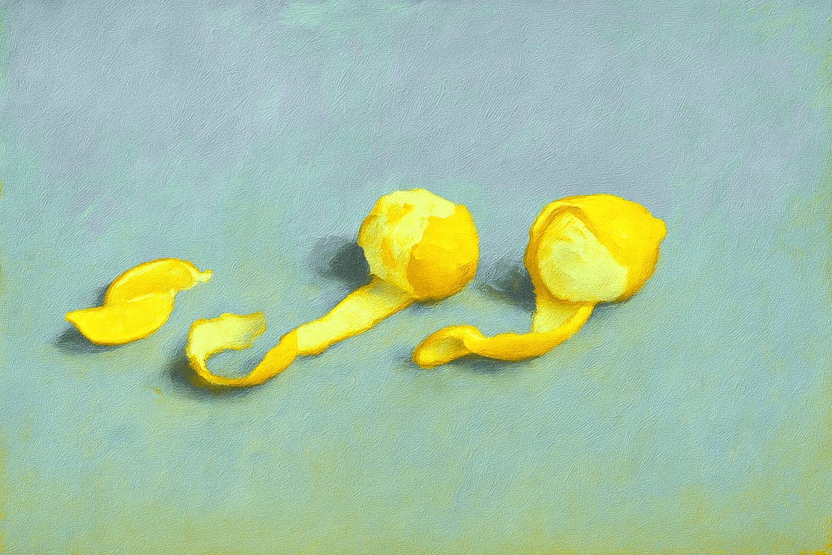 Lemon halves and peels on a light blue surface. Lemon halves and peels on a light blue surface.