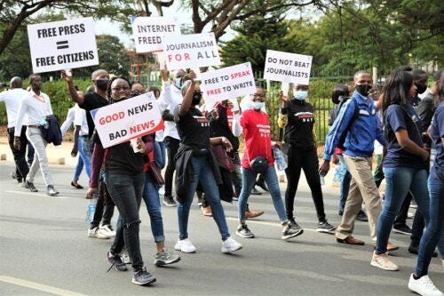 A group of people marching with signs

Description automatically generated with medium confidence