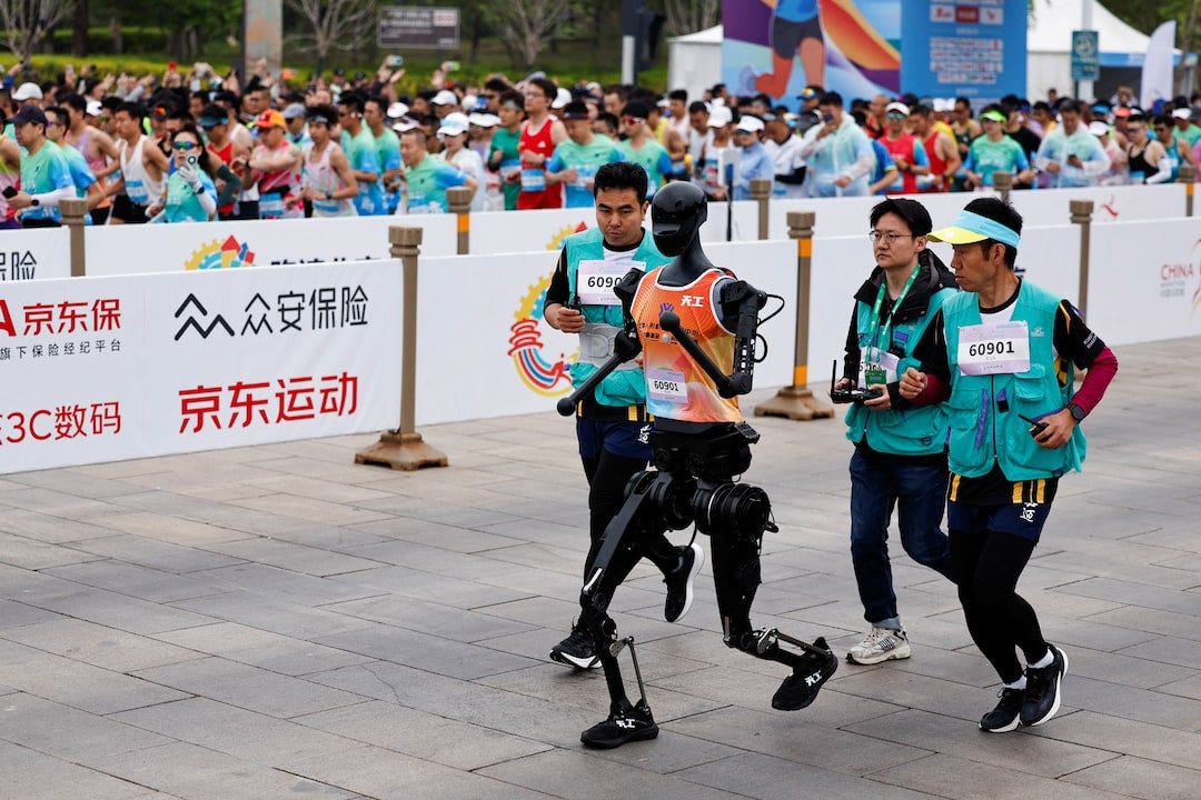 China pits humanoid robots against humans in half-marathon | Reuters