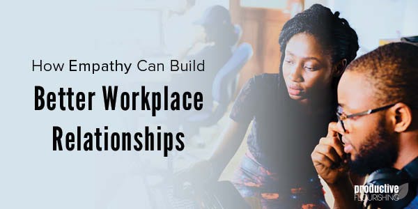 Two people looking at a computer. Text overlay: How Empathy Can Build Better Workplace Relationships Two people looking at a computer. Text overlay: How Empathy Can Build Better Workplace Relationships