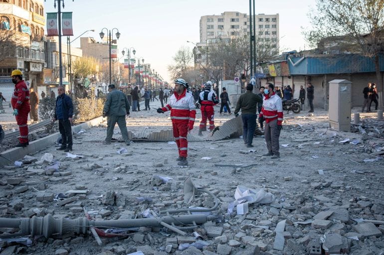 Rescue workers stand near the site of an Israel and U.S. strike on a police station in Tehran, Iran, March 3, 2026. Majid Khahi/ISNA/WANA (West Asia News Agency) via REUTERS ATTENTION EDITORS - THIS PICTURE WAS PROVIDED BY A THIRD PARTY Rescue workers stand near the site of an Israel and U.S. strike on a police station in Tehran, Iran, March 3, 2026. Majid Khahi/ISNA/WANA (West Asia News Agency) via REUTERS ATTENTION EDITORS - THIS PICTURE WAS PROVIDED BY A THIRD PARTY