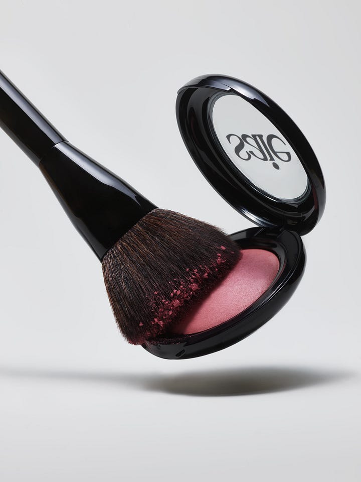 Two images: A makeup brush dipping into a blush compact; and round discs of blush scattered on a grey background.