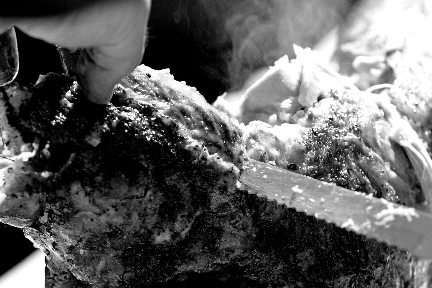 a person is cutting meat with a knife a person is cutting meat with a knife