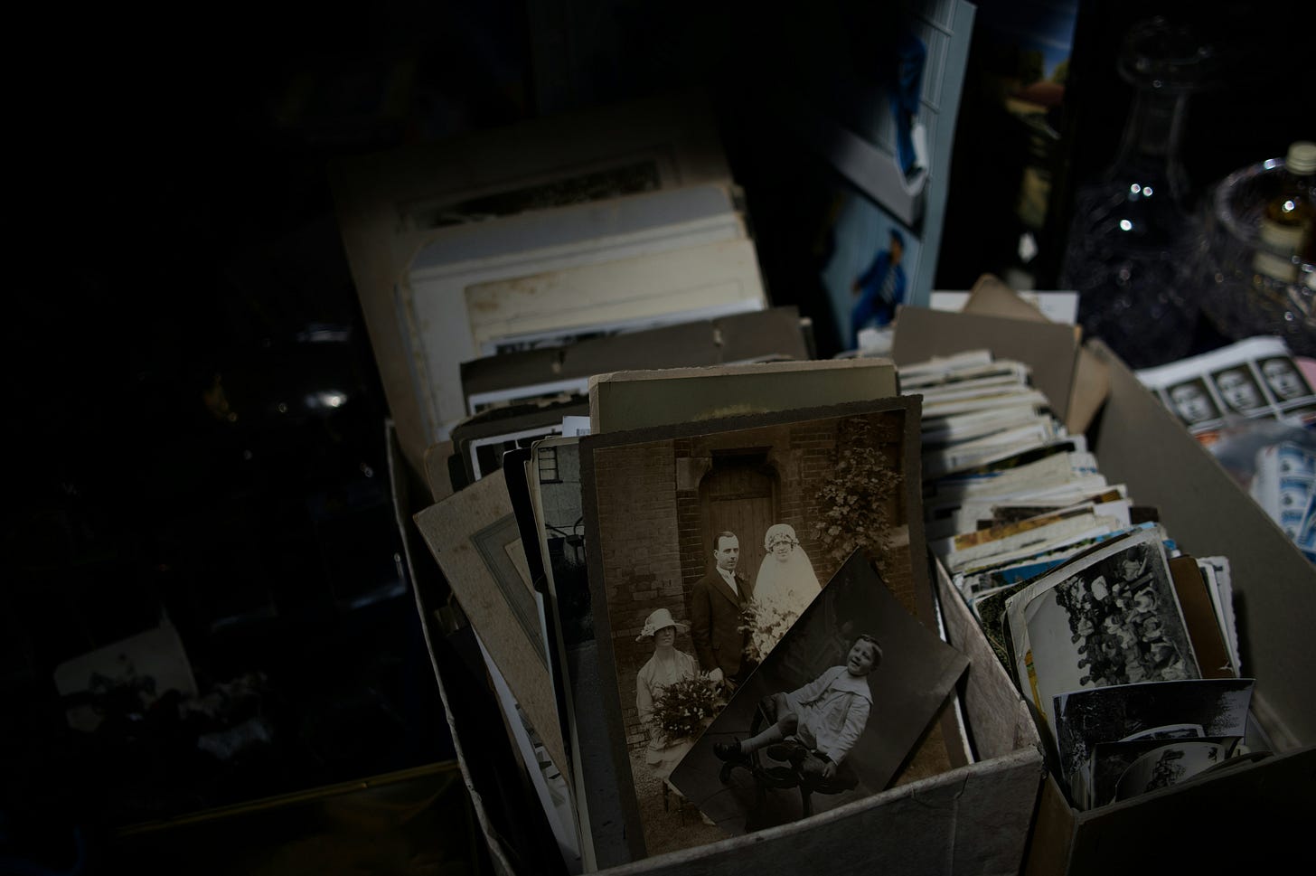Box of old photographs for sale.