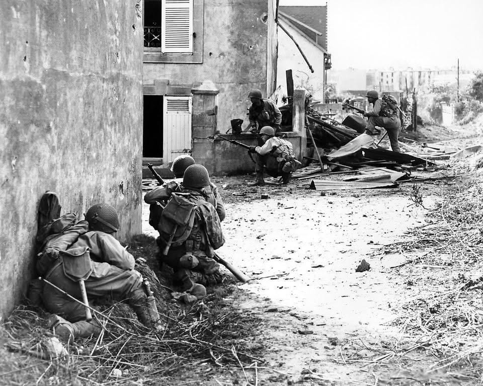 Soldiers of the 2nd Infantry Division 'Indian Head' bravely advance under machine gun fire into the outskirts of Brest, France, September 9, 1944.