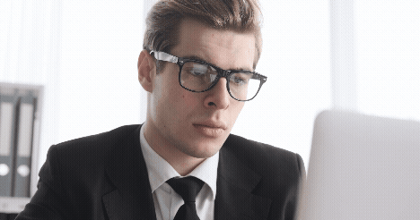 Gif animation of a man rubbing his eyes and head in defeat.