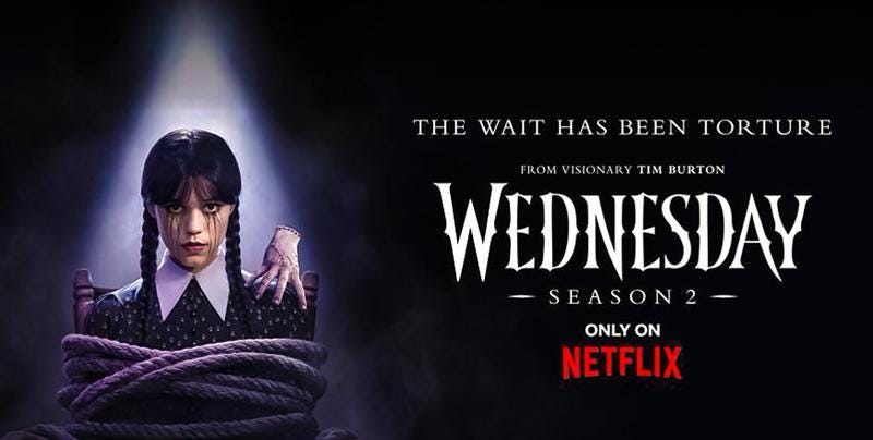 Jenna Ortega as Wednesday Addams sitting in a chair tied up with Thing on her left shoulder next to ad for Wednesday saying 