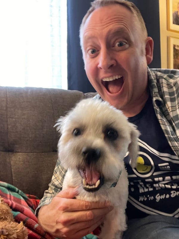 Dr. Dave with his new dog, a small white lapdog