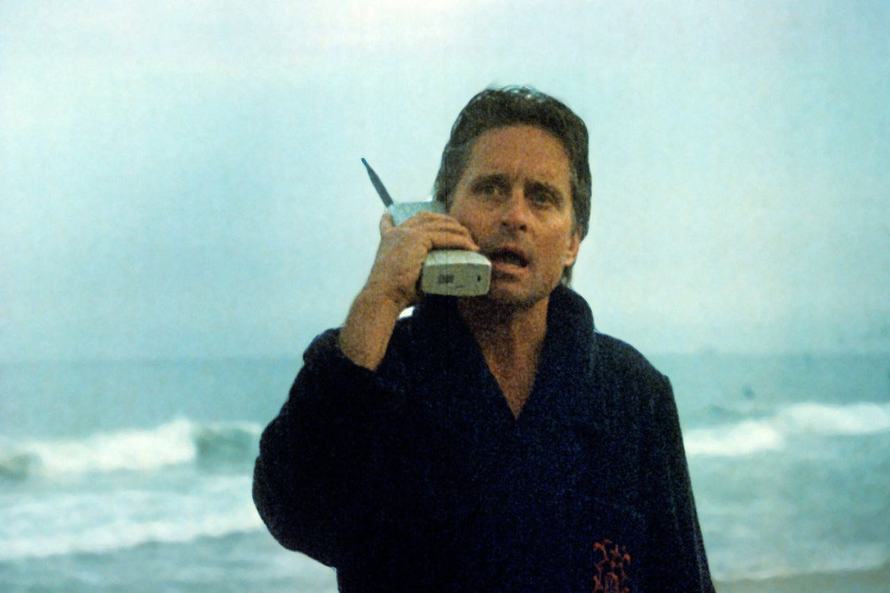 Photos: Memorable Phone Moments in Film and TV - Gordon Gekko of "Wall Street" talking on the original mobile phone while on the beach. Photos: Memorable Phone Moments in Film and TV - Gordon Gekko of "Wall Street" talking on the original mobile phone while on the beach.