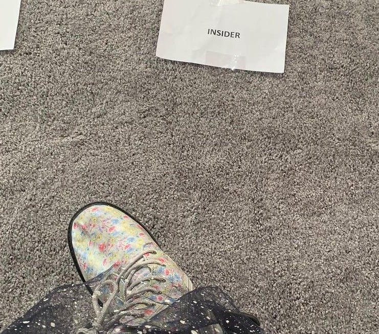 Tony's gray carpet, silver boots with multicolored designs