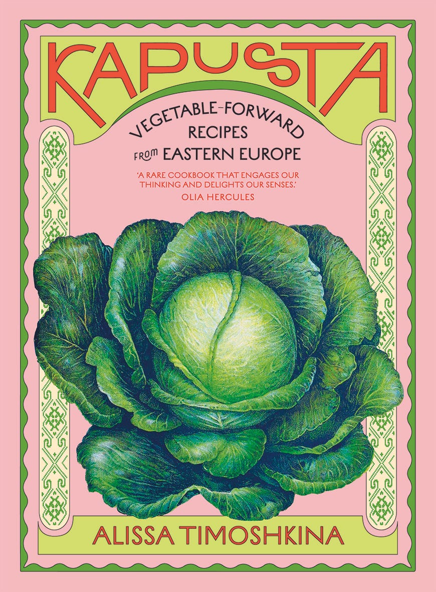 Pink cover of Kapusta cookbook with illustrated cabbage.
