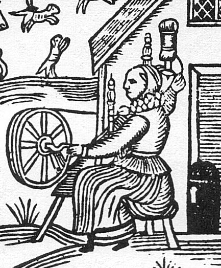 Woodcut showing an Elizabethan woman working at the spinning wheel Woodcut showing an Elizabethan woman working at the spinning wheel