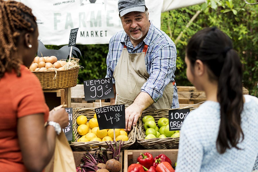 Selling produce at local farmers market