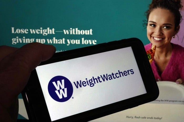 Weight Watchers logo on a phone screen.