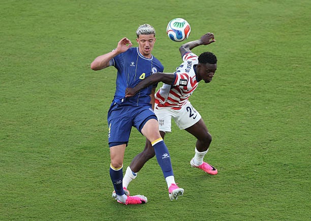 Folarin Balogun of the United States fouls Tarik Muharemovic of Bosnia and Herzegovina which is later reviewed by VAR and awarded as a red card foul... Folarin Balogun of the United States fouls Tarik Muharemovic of Bosnia and Herzegovina which is later reviewed by VAR and awarded as a red card foul...