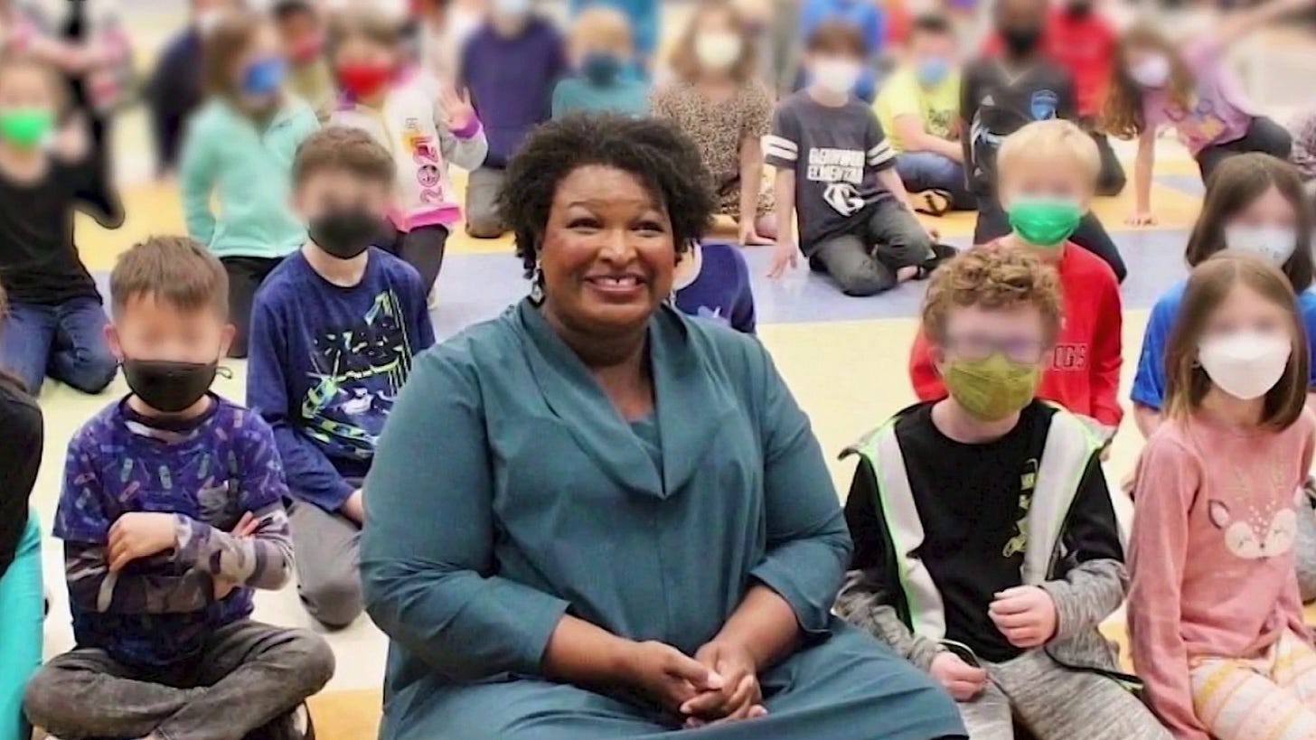 Stacey Abrams faces backlash after maskless photo with students Stacey Abrams faces backlash after maskless photo with students