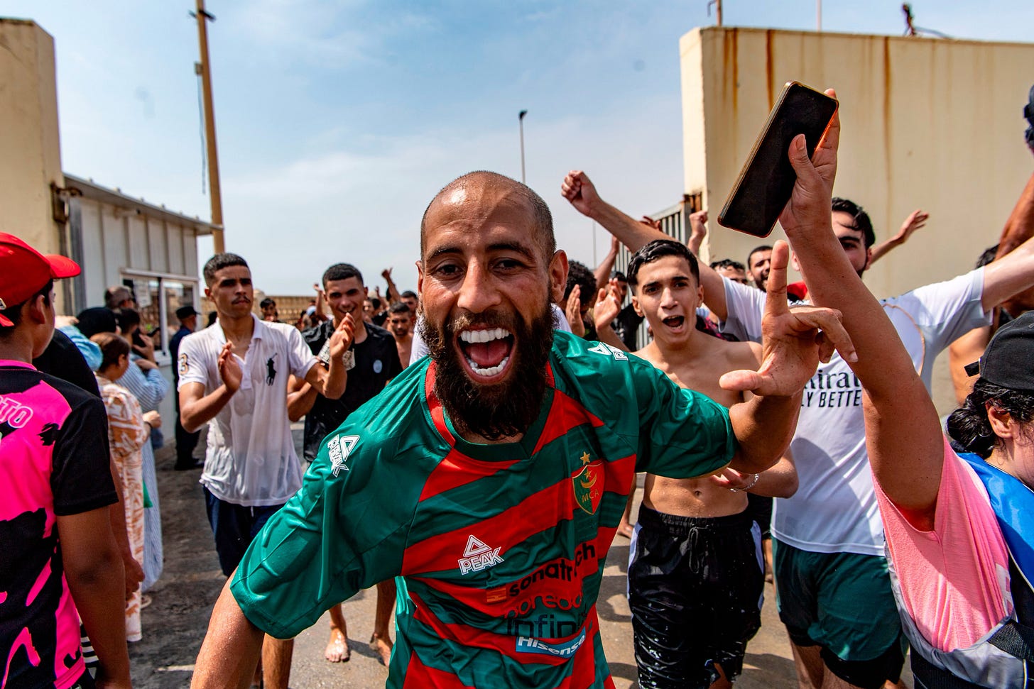 Migrants cross from Morocco into Ceuta on Thursday. Photo: AP
