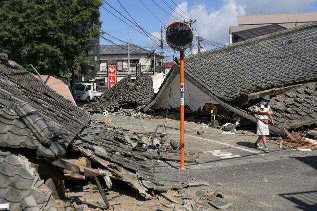 Image showing collapsed houses in Yatsushiro, Kumamoto Prefecture, Japan, on 31 July, three days after a powerful earthquake struck the area.