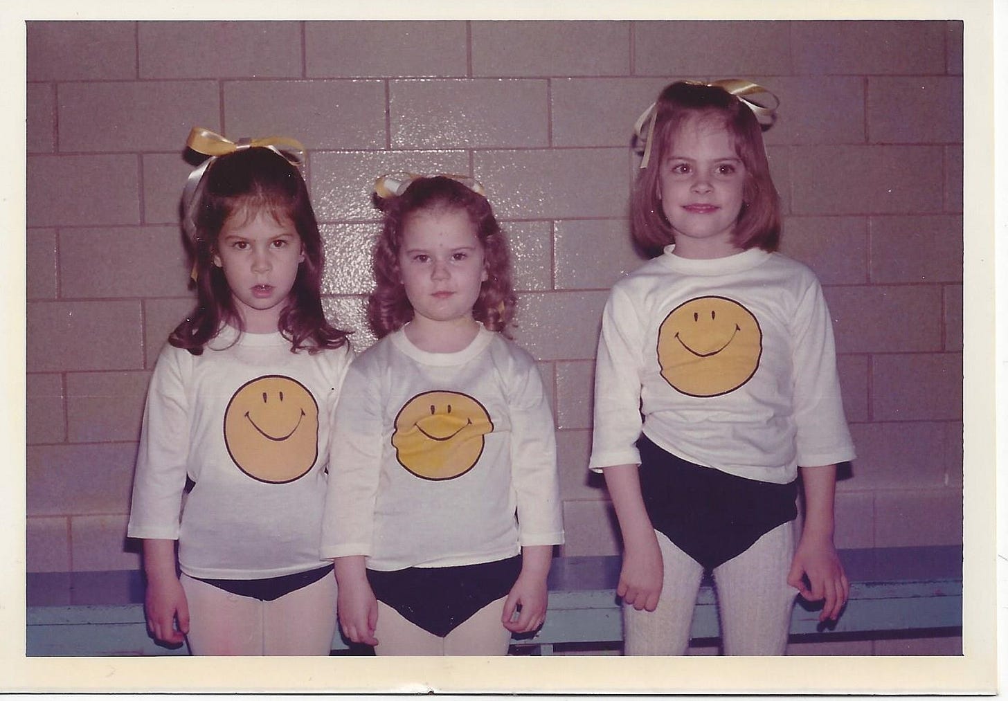 Three kindergarten-aged girls in costume, prepared for their dance recital Three kindergarten-aged girls in costume, prepared for their dance recital