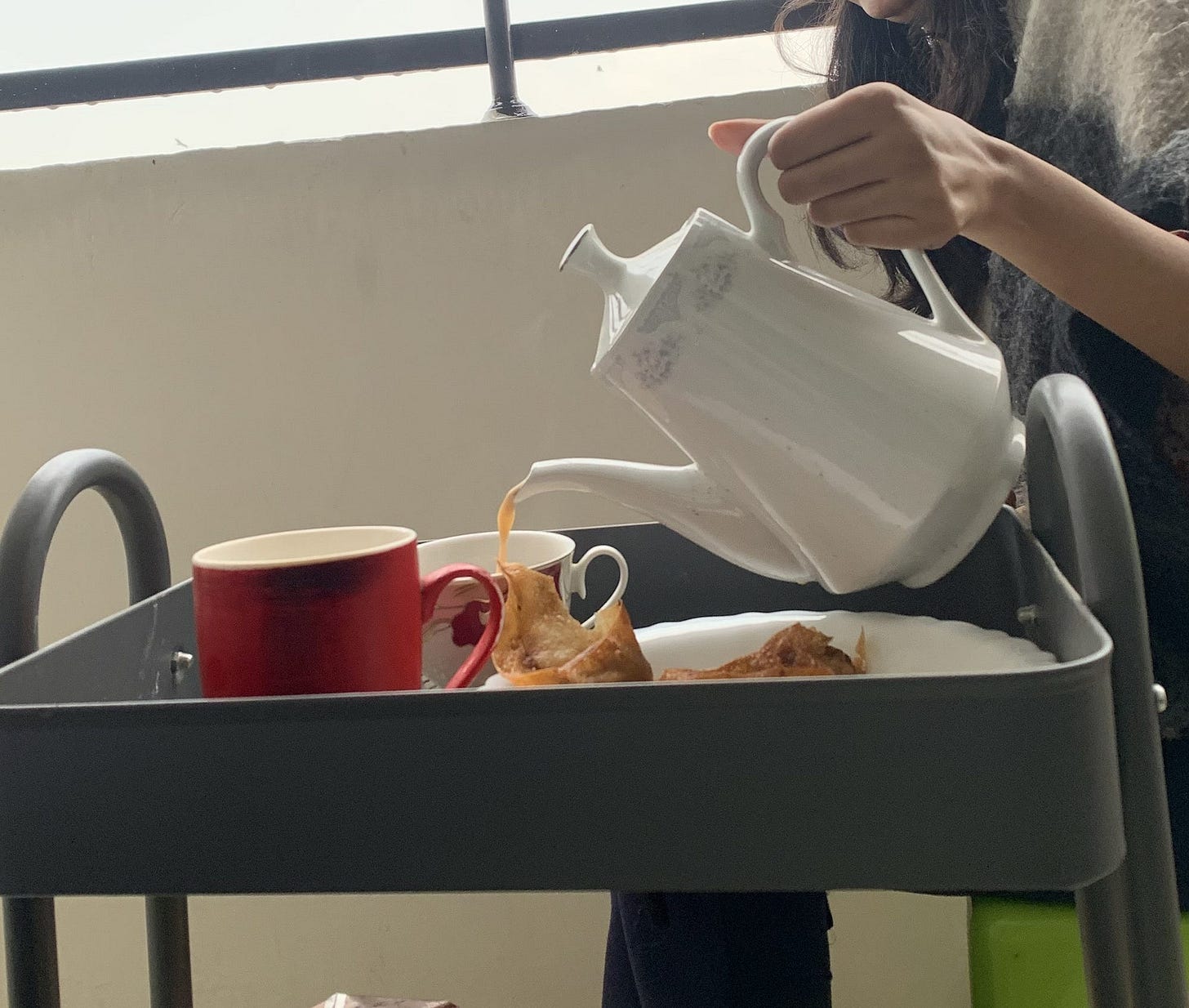 Author pouring tea