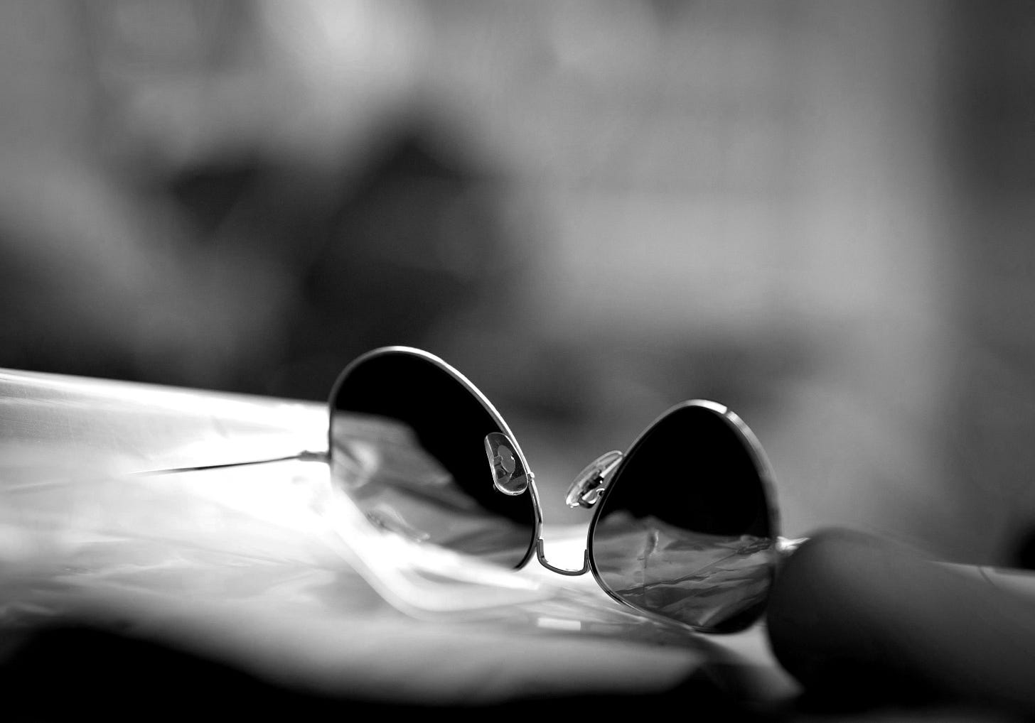 a pair of sunglasses sitting on top of a table