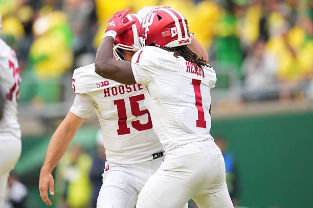 Roman Hemby of the Indiana Hoosiers celebrates with Fernando Mendoza after a touchdown during the first half against the Oregon Ducks at Autzen...