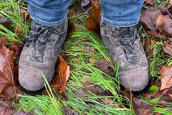 A pair of Berghaus Storm pictured on my feet under a pair of jeans and on top of wet grass and fallen leaves. I bought them in 1994 for a trip into Africa. Still going strong in the last few days of 2022.