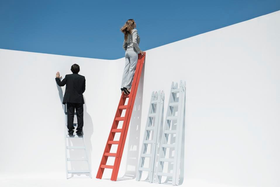 Businesswoman at top of ladder