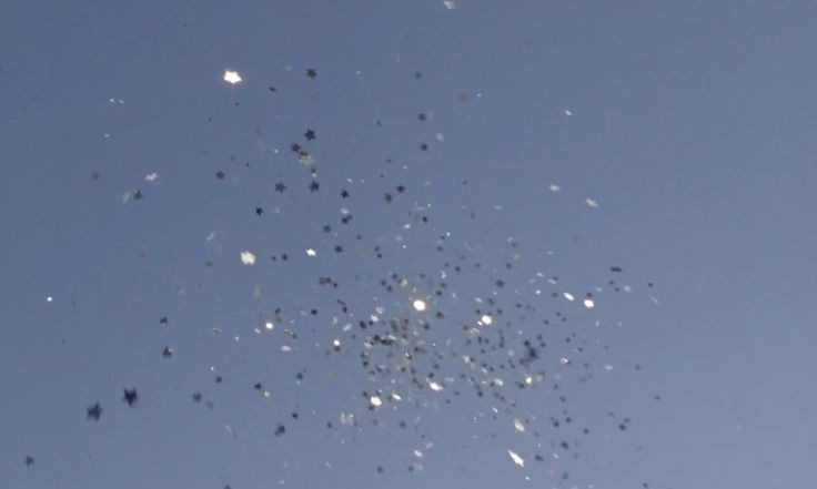 This may contain: the sky is filled with many small objects