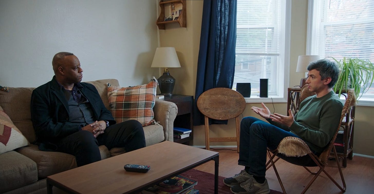 Nathan Fielder and Kor Skeet in Skeet's living room