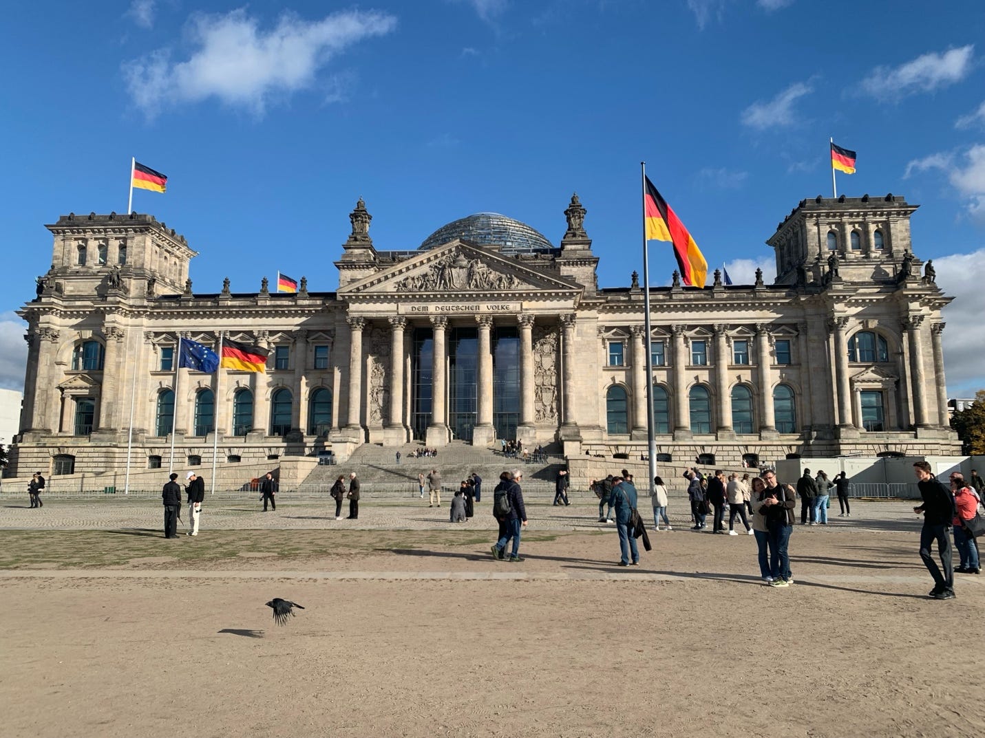 Reichstag building with many flags

AI-generated content may be incorrect.