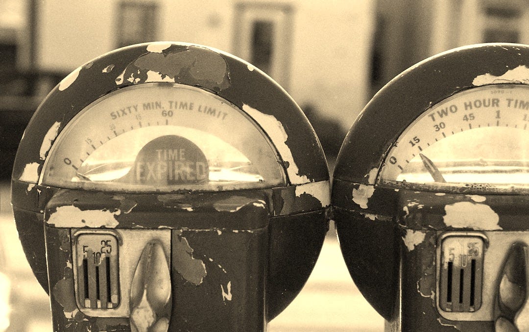 two round blue-gray-and-yellow analog devices