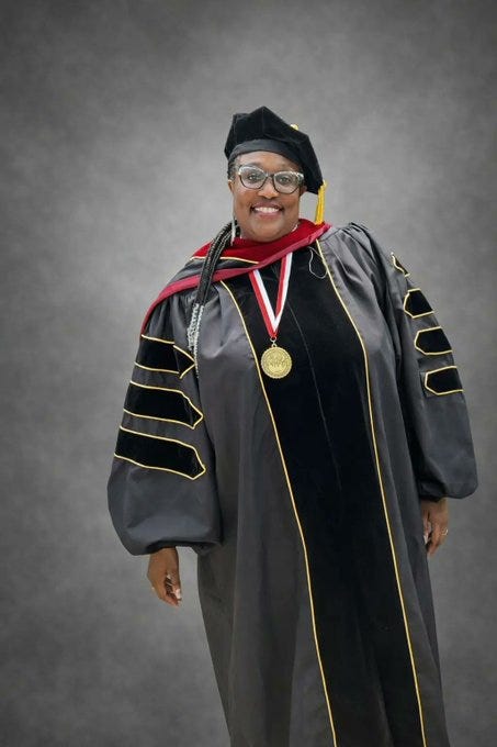 Photo of Linda Davis at a graduation ceremony Photo of Linda Davis at a graduation ceremony