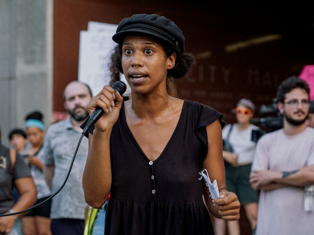 a person singing into a microphone