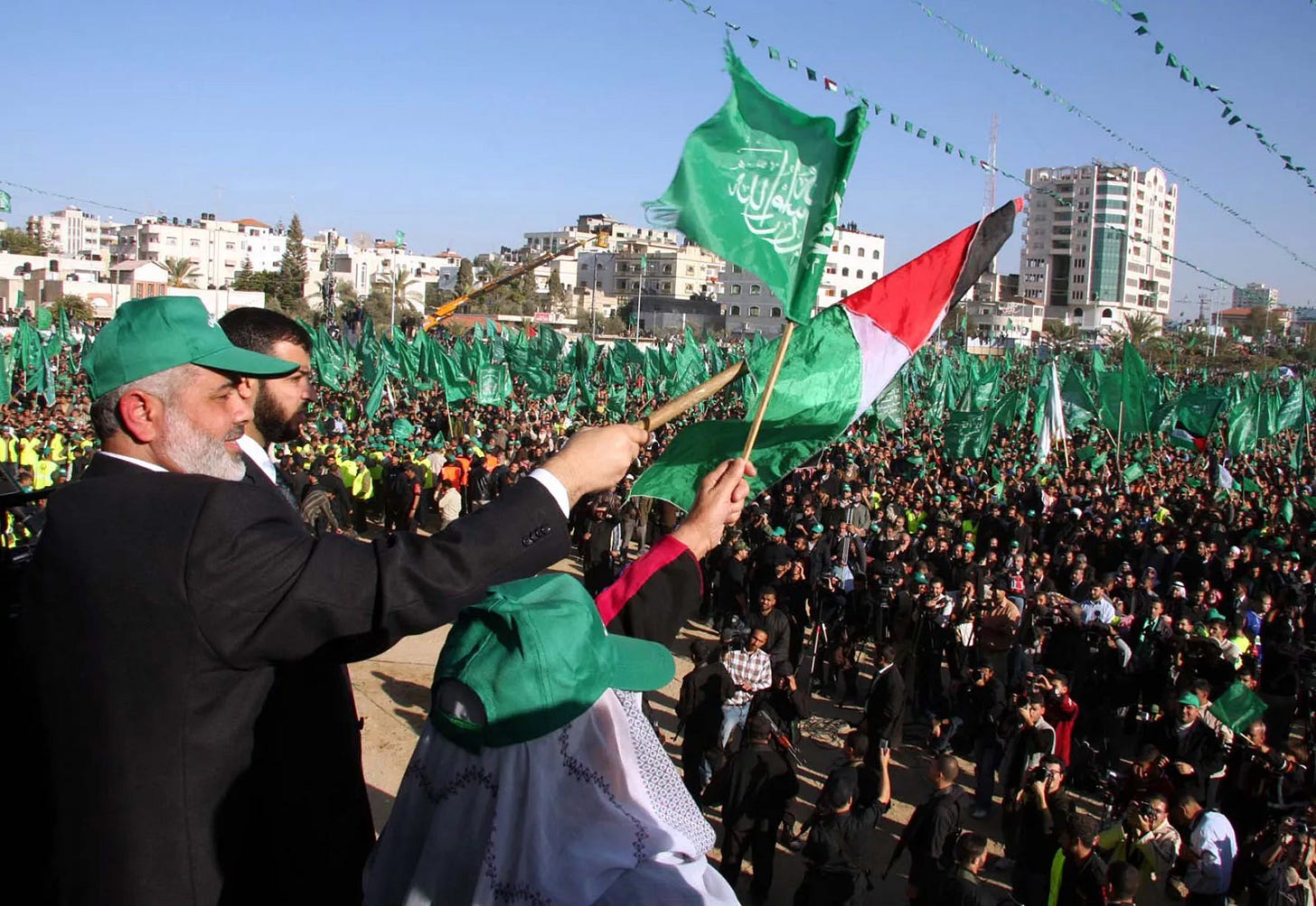 Ismail Haniyeh—a senior figure within Hamas and former prime minister of the Palestinian Authority (March 2006–June 2007)—waving to supporters at a rally for Hamas in the Gaza Strip, December 15, 2007.
