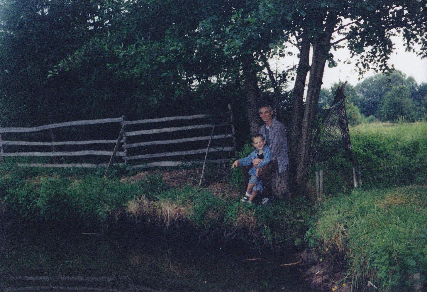 Kazik teaching Kuba to fish