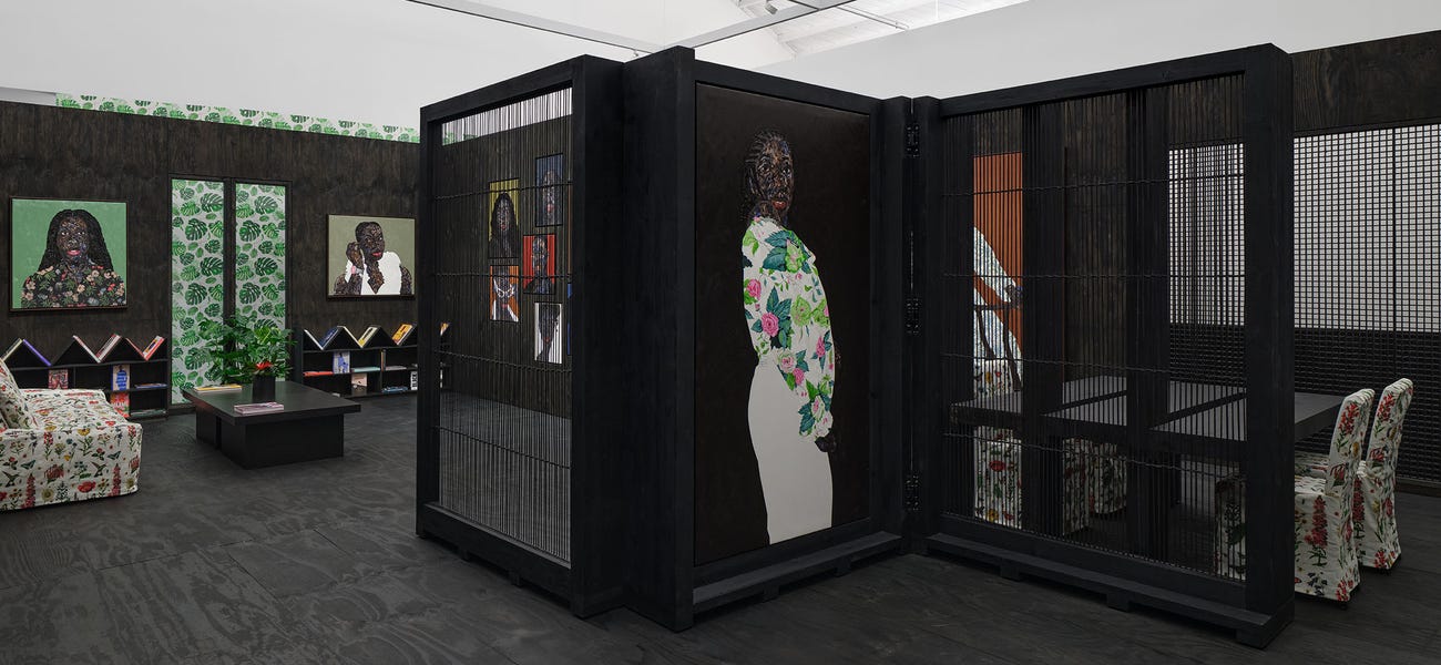 Amoako BoafoGallery installation view with multiple artworks displayed on walls and freestanding black partitions inside an exhibition space. Amoako BoafoGallery installation view with multiple artworks displayed on walls and freestanding black partitions inside an exhibition space.