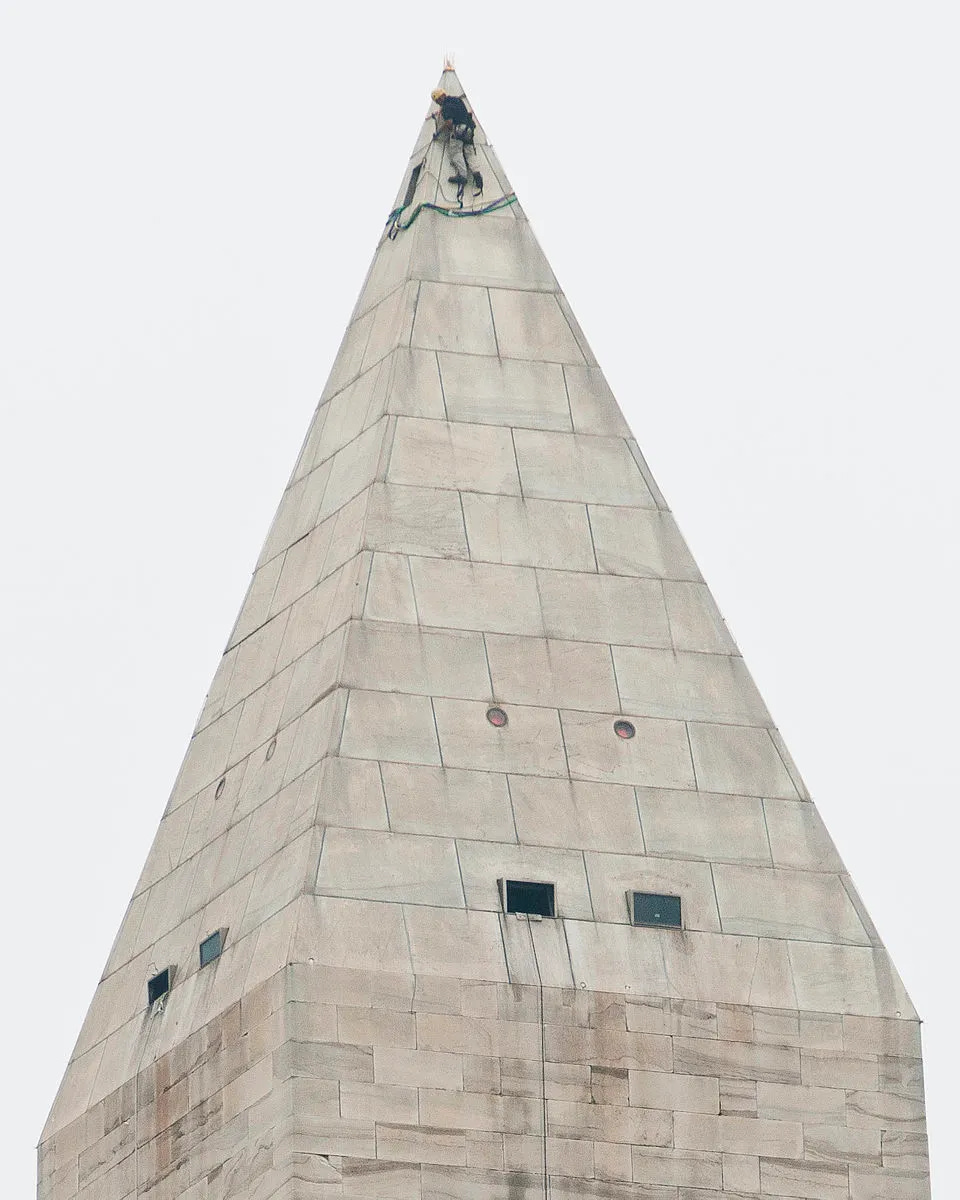A repair worker at the top of the Washington Monument. A repair worker at the top of the Washington Monument.