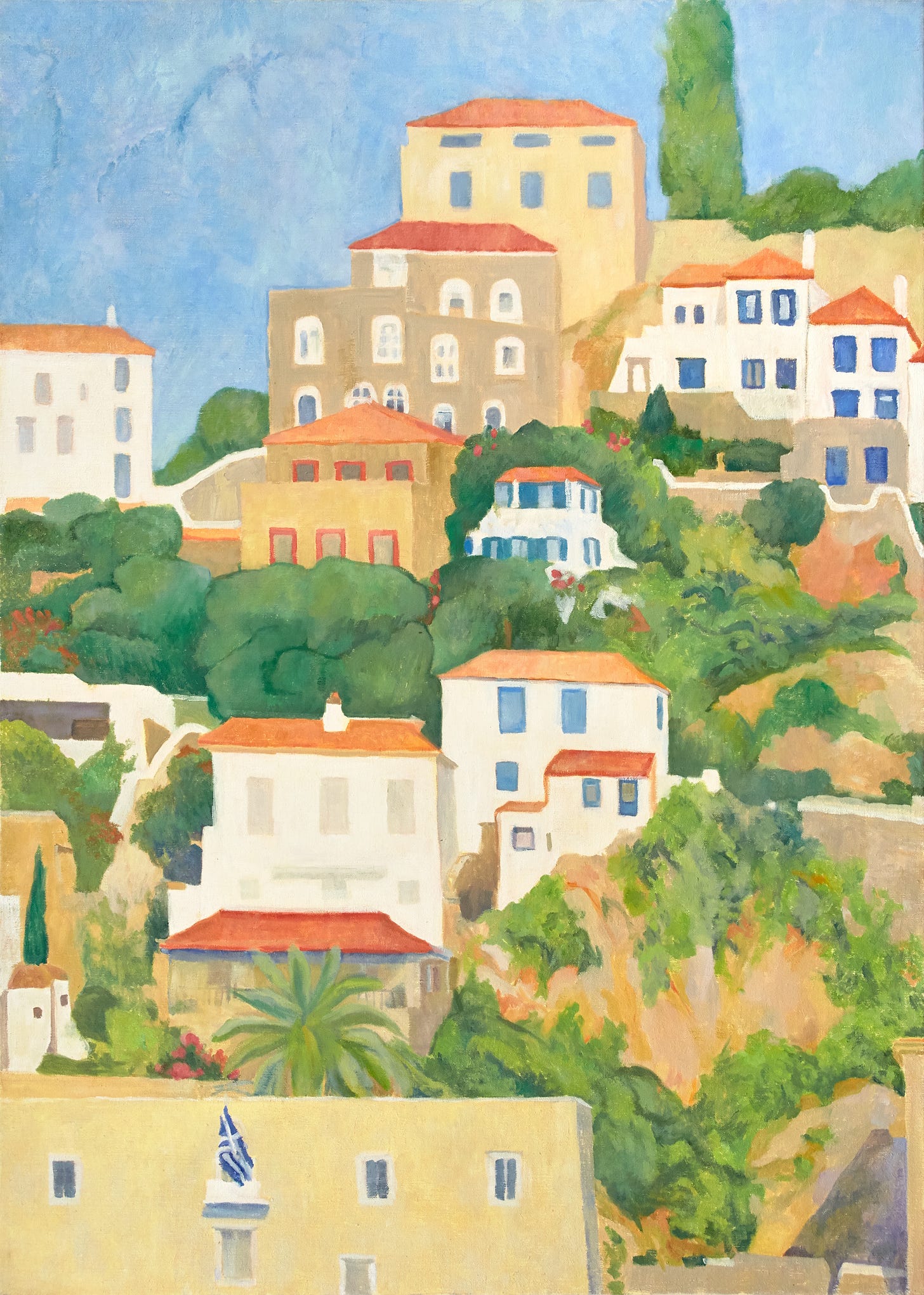 Tightly clustered houses with terracotta roofs climb a hillside into a brilliant blue sky among green trees. The Greek flag is waving from one balcony.