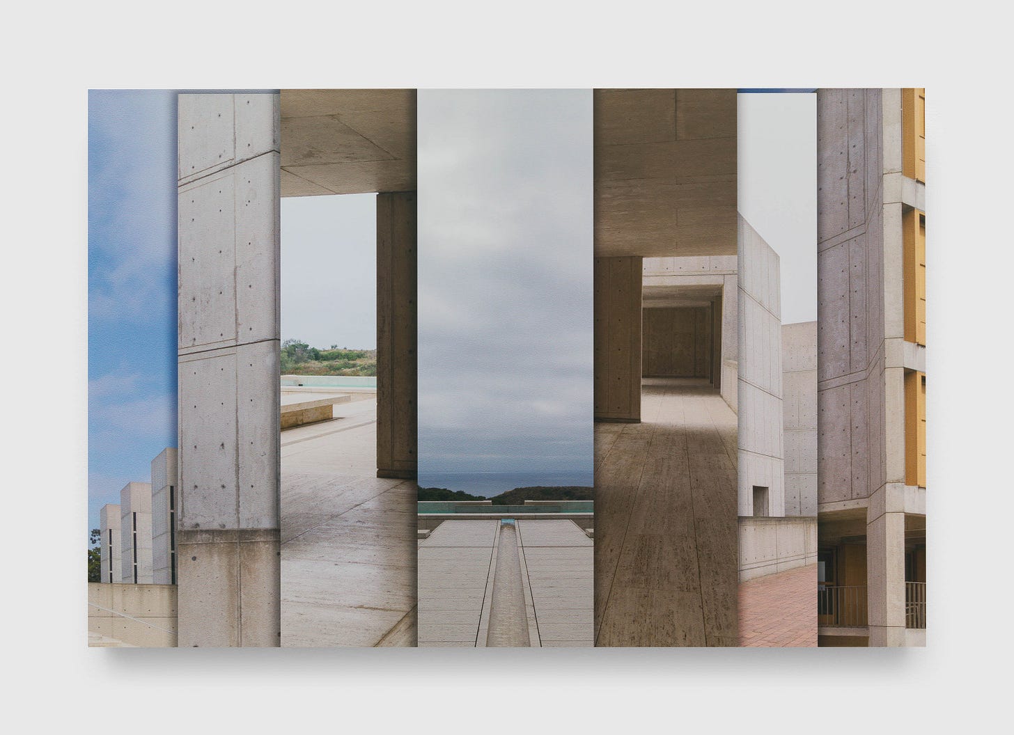 A head-on shot of James Welling's Salk Institute photograph/collage, set against a white background. From the horizontal center, various layers of different views of the architecture unfold, gently casting shadows upon each layer below.
