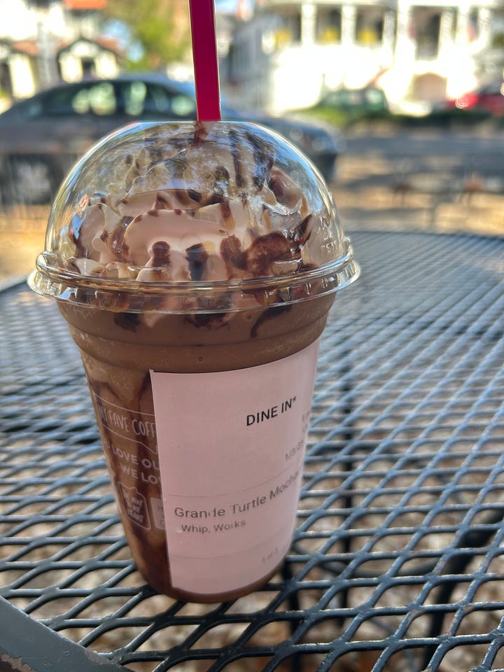 A tree canopy with blue sky and a delicious sugary coffee
