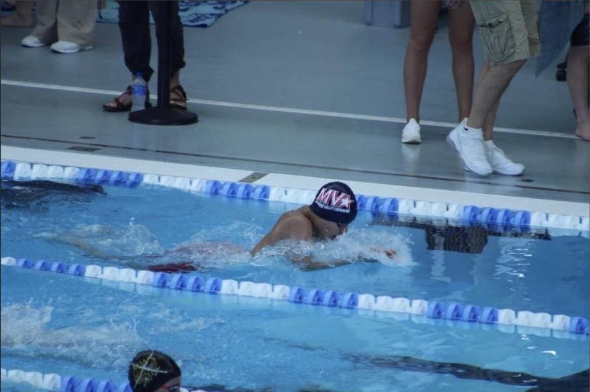 My son, the swimmer, at a championship meet.