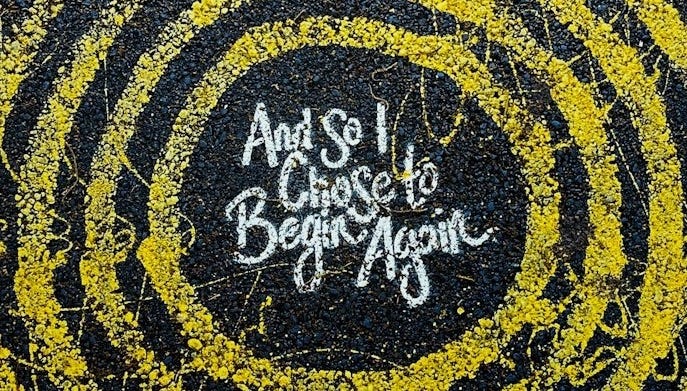 yellow and black round logo