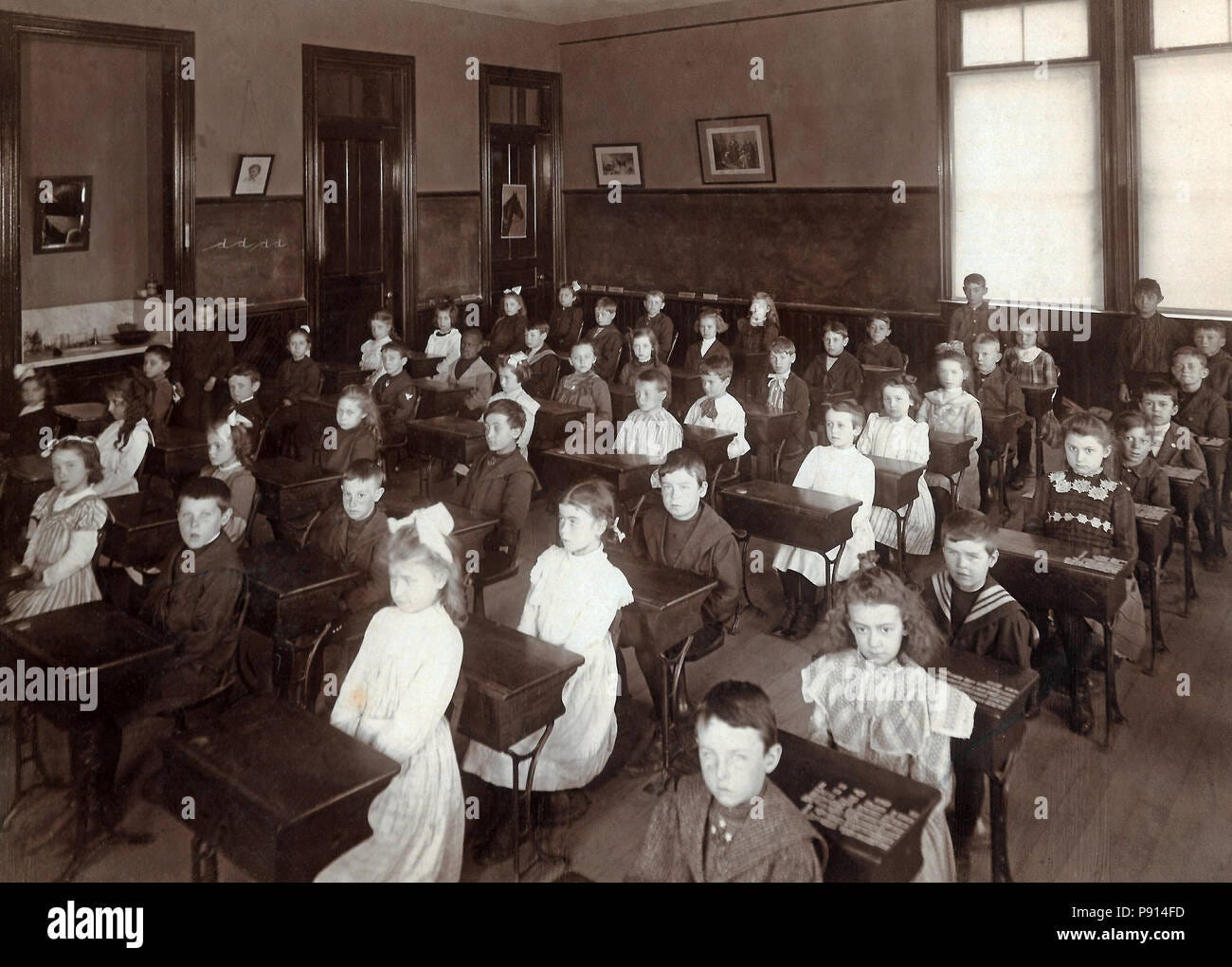 Vintage classroom of school children at desks circa 1890s Stock Photo ...