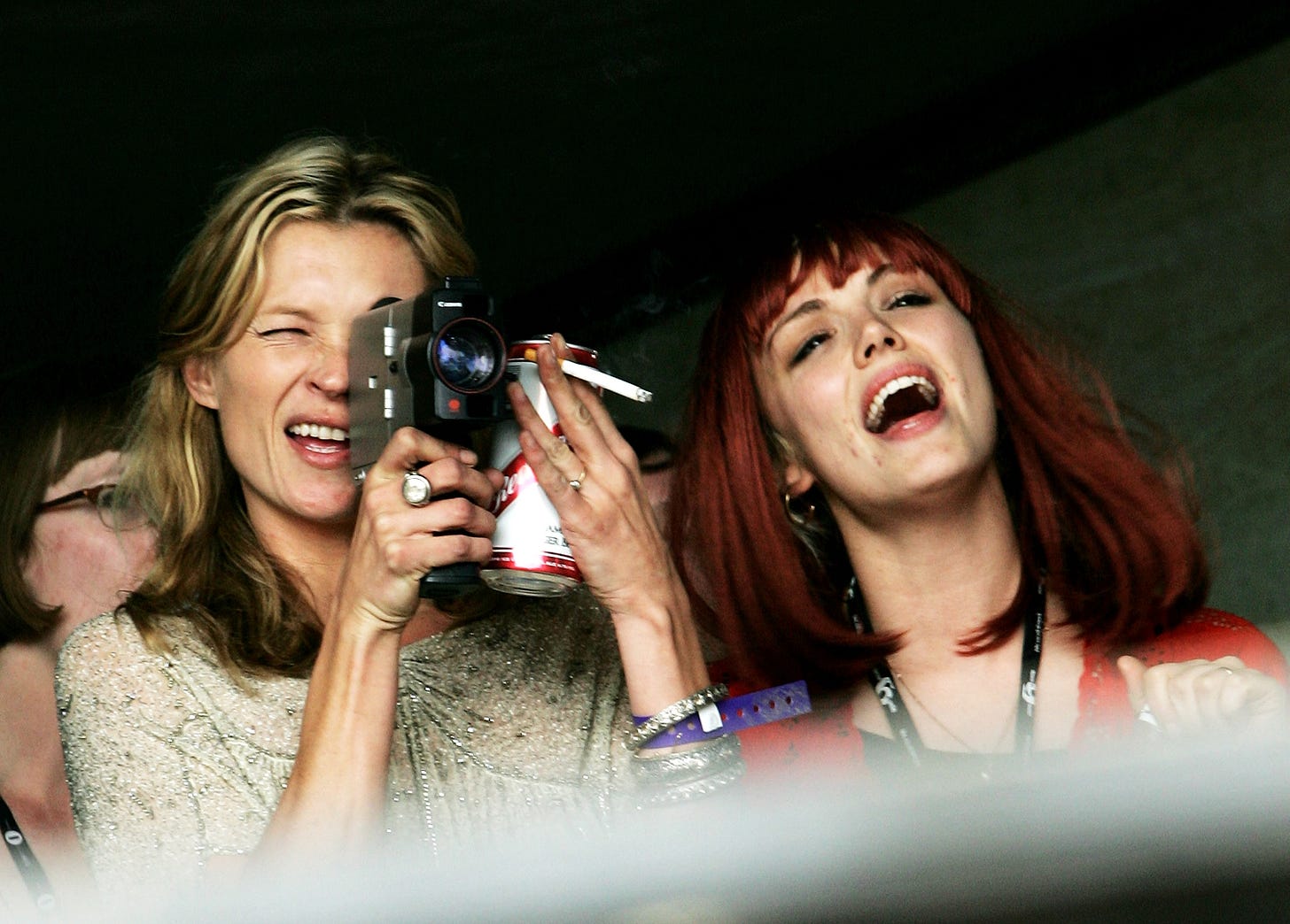 Model Kate Moss and Mairead Nash on the Park acoustic stage on the third day of the Glastonbury Festival in 2007. She is wearing a gold top. Model Kate Moss and Mairead Nash on the Park acoustic stage on the third day of the Glastonbury Festival in 2007. She is wearing a gold top.