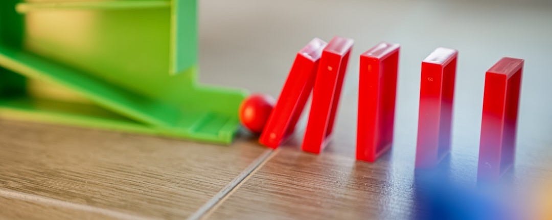 A close up of a game of dominos on a table